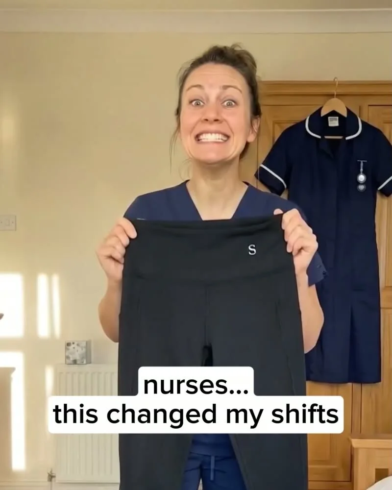Nurse in scrubs holding up a pair of Skinnify leggings