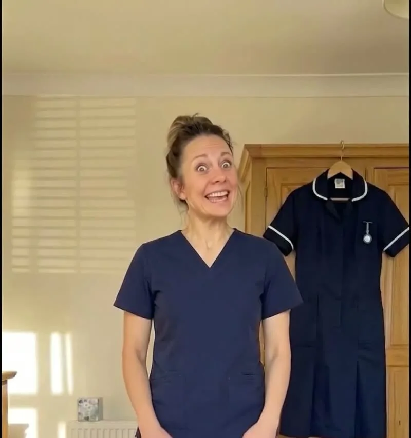 Nurse in scrubs at home after her shift