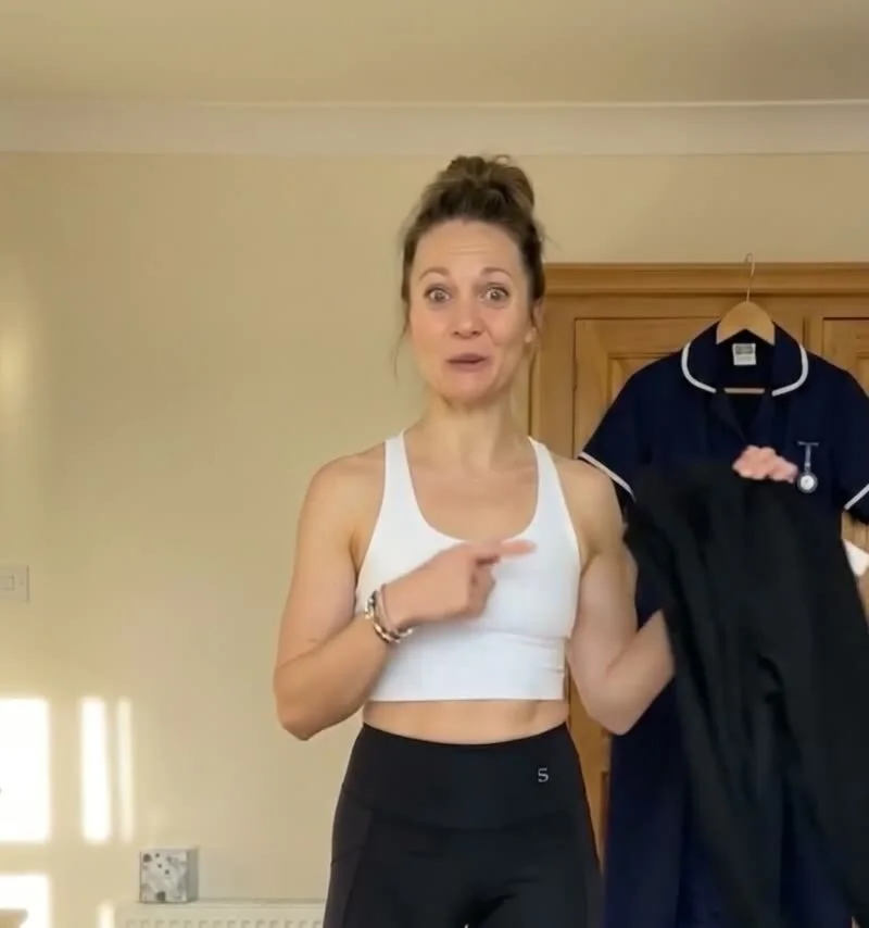Nurse pointing to the waistband of her Skinnify leggings